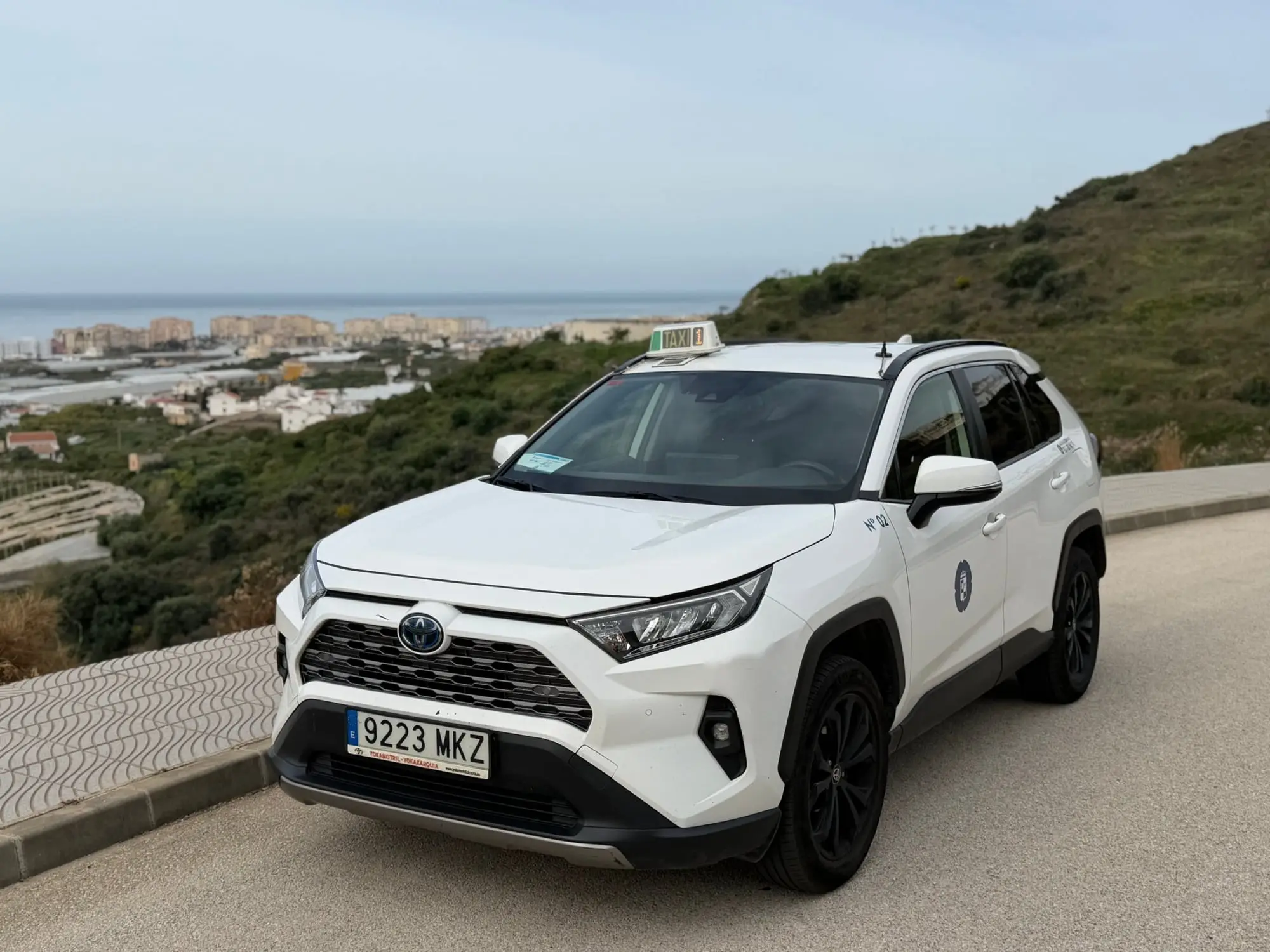 Torrox taxi at a viewpoint overlooking the coast and the villages of the Axarquía